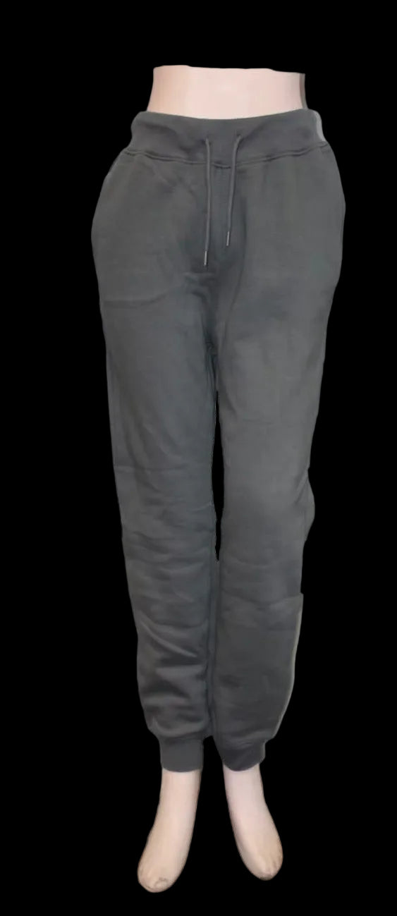 Dark gray jogger pants on a mannequin against a white background