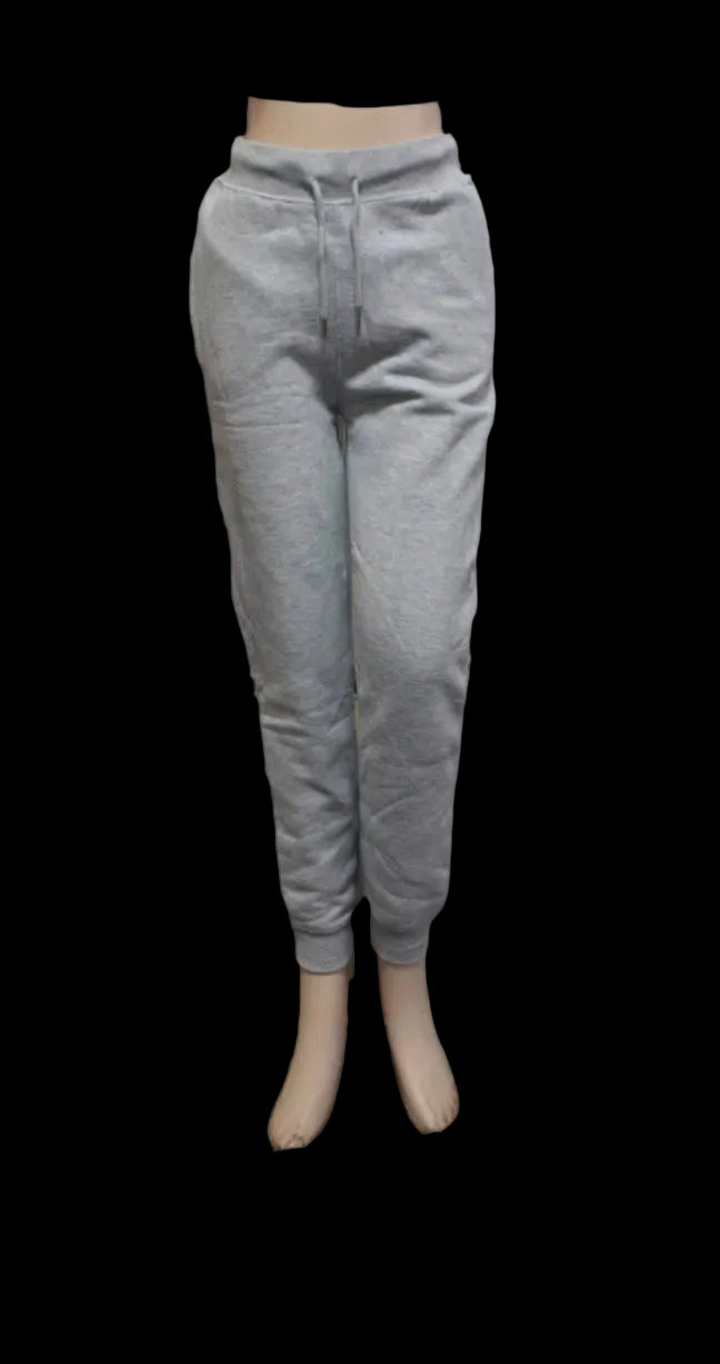 Gray sweatpants on a mannequin against a white background