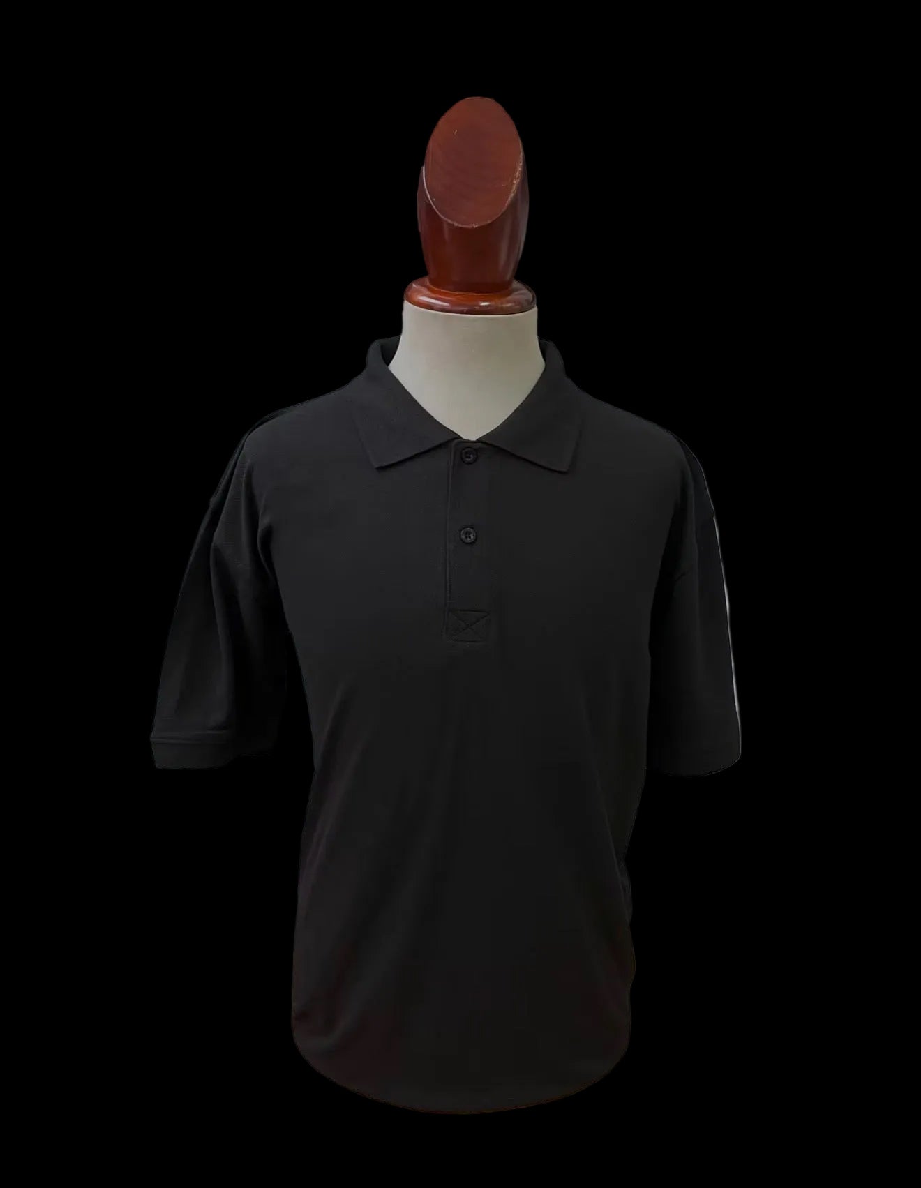 Black polo shirt blank on a mannequin against a white background
