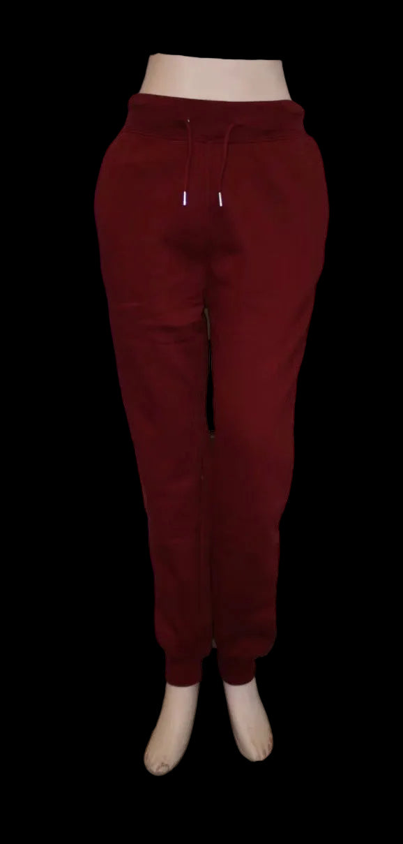Burgundy sweatpants on a white background