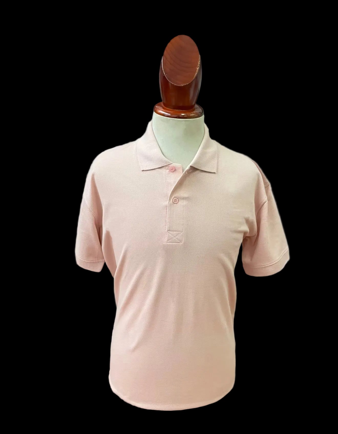 Peach polo shirt blank on a mannequin against a white background